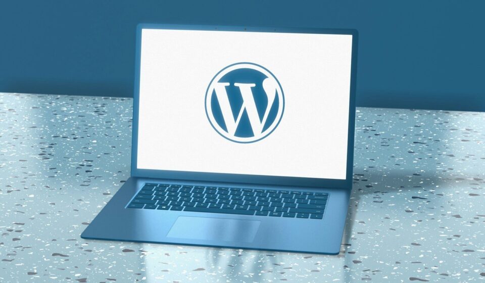 a laptop computer sitting on top of a table