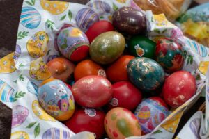 Vibrant Easter eggs arranged in a decorative basket, perfect for holiday celebrations.